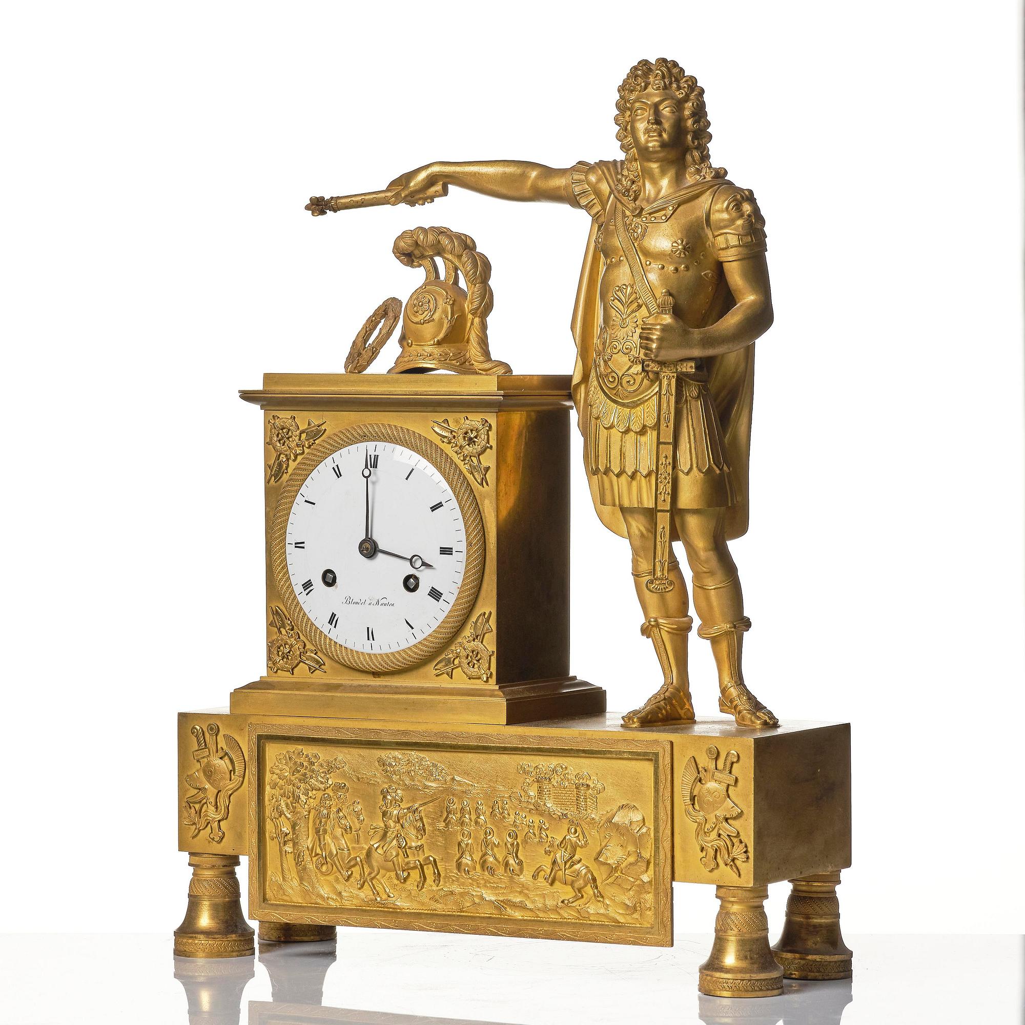 A French Empire figural ormolu mantel clock, early 19th century.