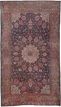 A CARPET. A semi-antique Kerman. 614,5 x 360,5 cm.