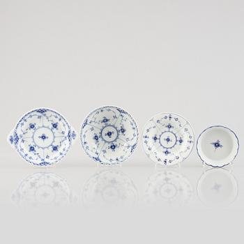 A group of four 'Blue Fluted' / *Musselmalet' porcelain dishes and a candle, Royal Copenhagen, 1893-1900 and later.