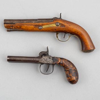 Two 19th century percussion pistols.