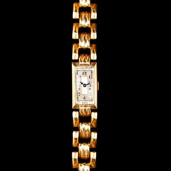 1135. A Patek Philippe ladie's gold wrist watch.