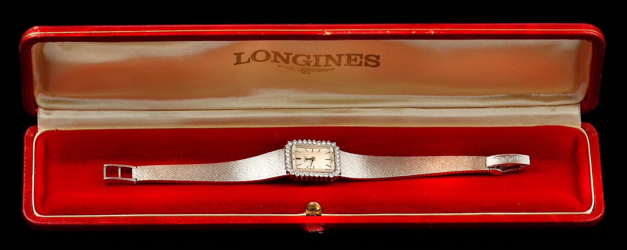 ARMBANDSUR, 18k vitguld med briljantslipade diamanter ca 0,60 ct. "Longines", cikt tot ca 42 g.
