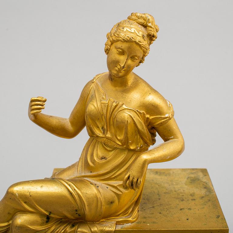 A first half of the 19th century Empire bronze mantle clock.