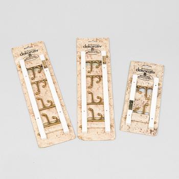 A set of three 'Dekorativ' coat hangers, Skoglunds metallgjuteri, Anderstorp, second half of the 20th century.