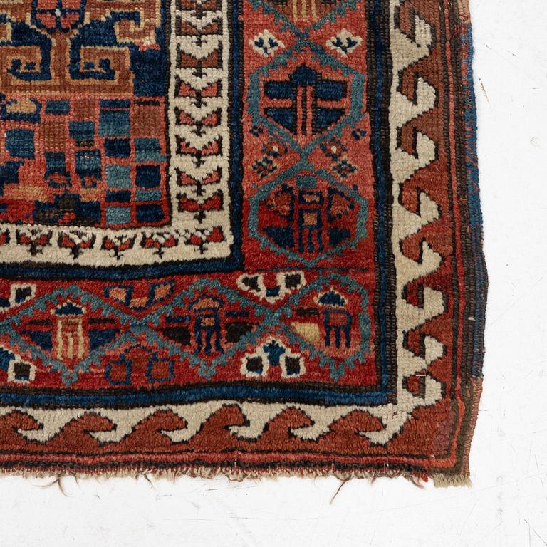 An antique Kurdish / Turkish carpet by the Herki Tribe, c 233 x 137 cm.