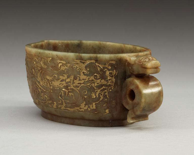 An archaistic carved and gilded vessel, Qing dynasty.