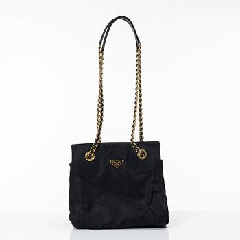 Prada, A black nylon bag.