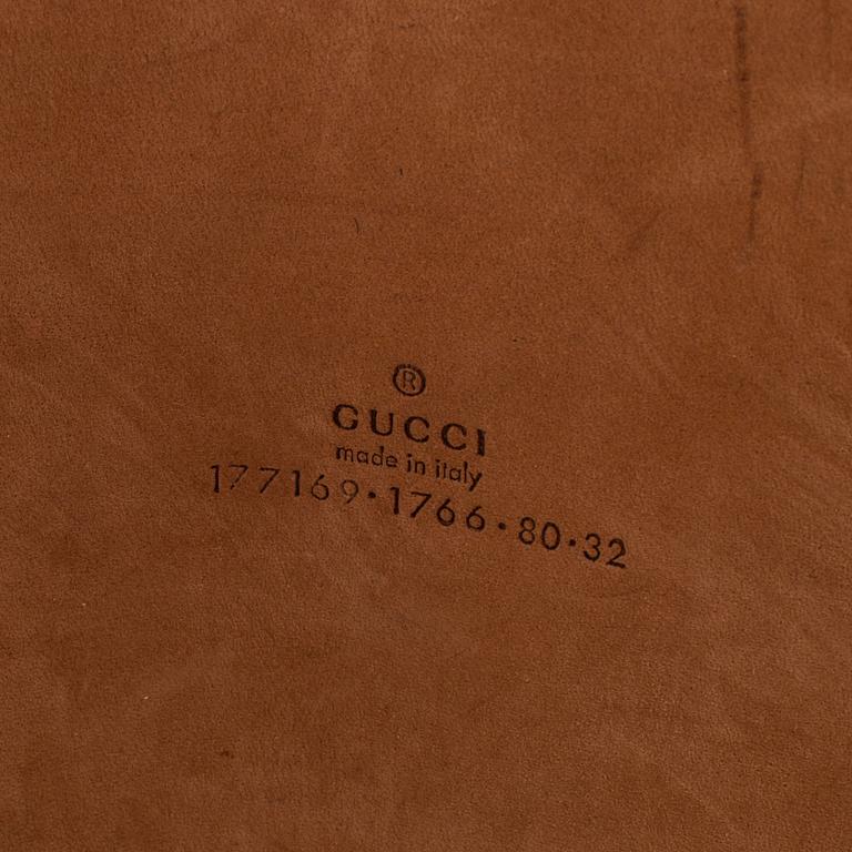 A belt by Gucci.