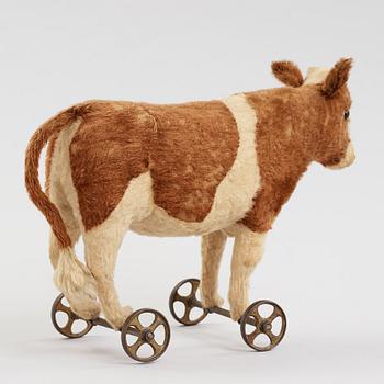 a STEIFF cow on wheels, Germany ca 1910.