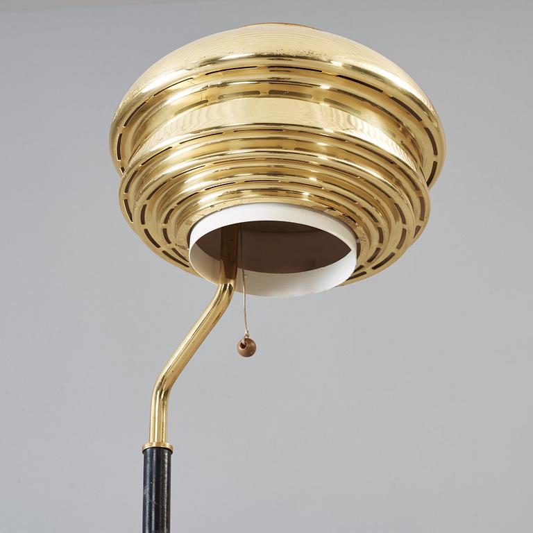 An Alvar Aalto 'A 808' brass and black leather floor lamp, Valaisinpaja, Finland late 1970's.