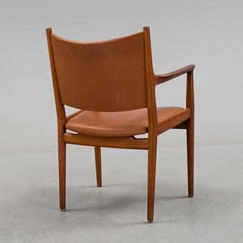 A Hans J Wegner teak and leather "JH 513" chair from Johannes Hansen, Denmark.