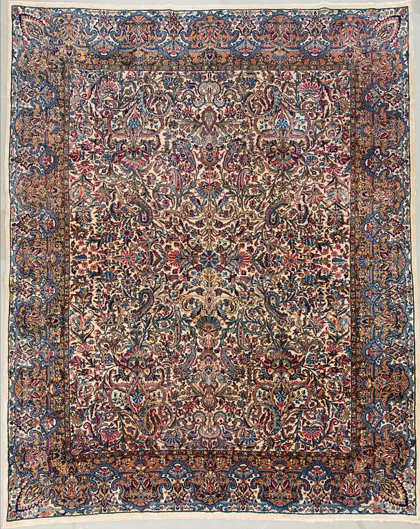 A semi-antique carpet from Kerman, 346 x 273 cm.