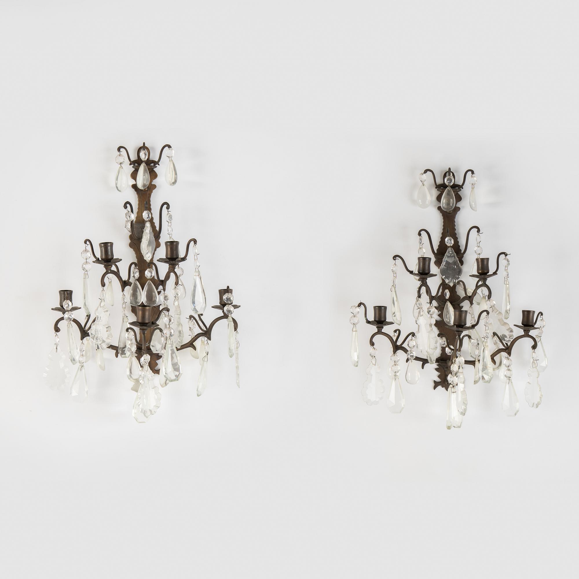 A pair of brass and cut glass five-light  baroque-style wall lights.