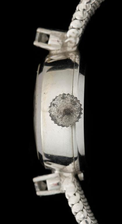 DAMARMBANDSUR, vitguld 18k, två små briljantslipade diamanter, Movado. Vikt ca 22 gram.