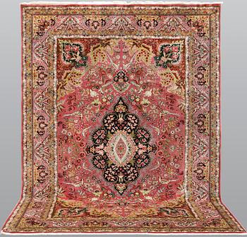 A Tabriz part silk carpet, 290 x 200 cm.