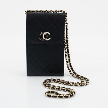 Chanel, a quilted black leather bag, 2021.