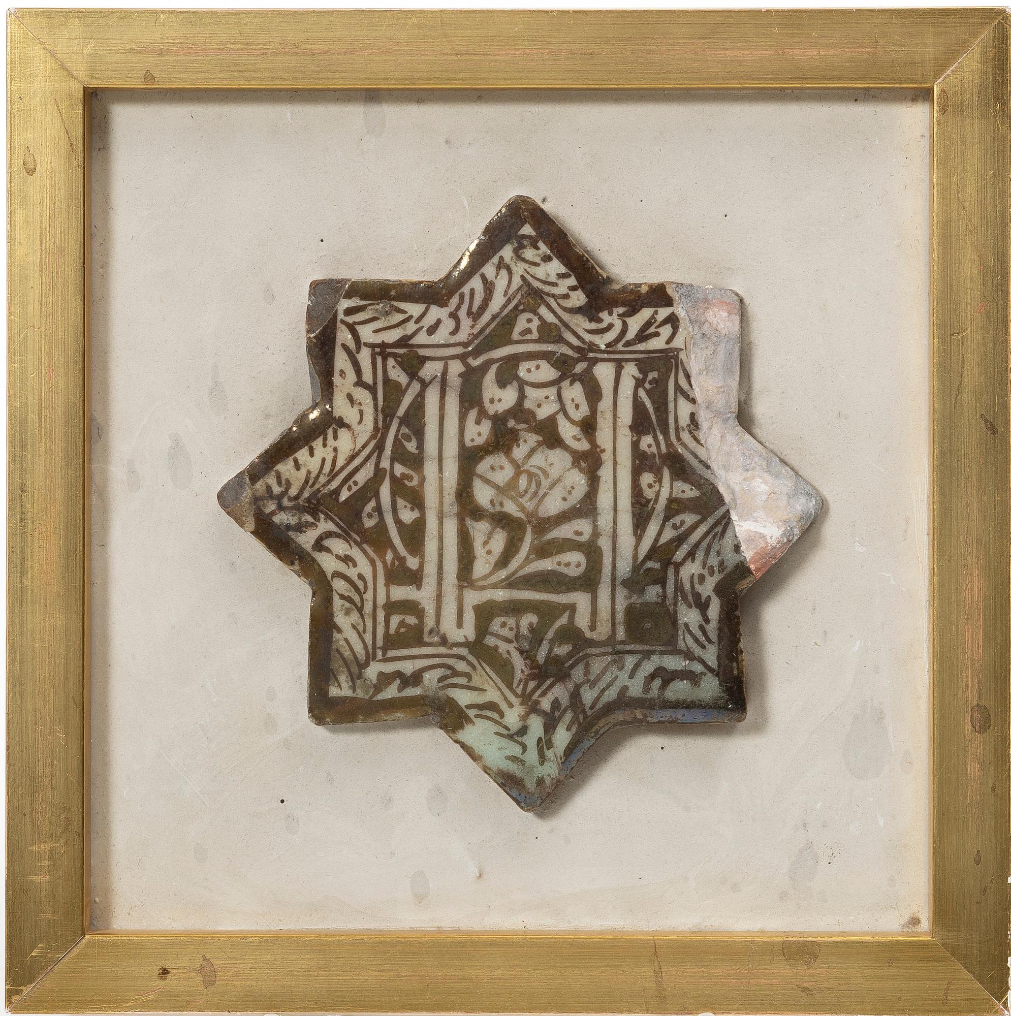A Kashan lustre-decorated star-tile, central persia, 14th century,