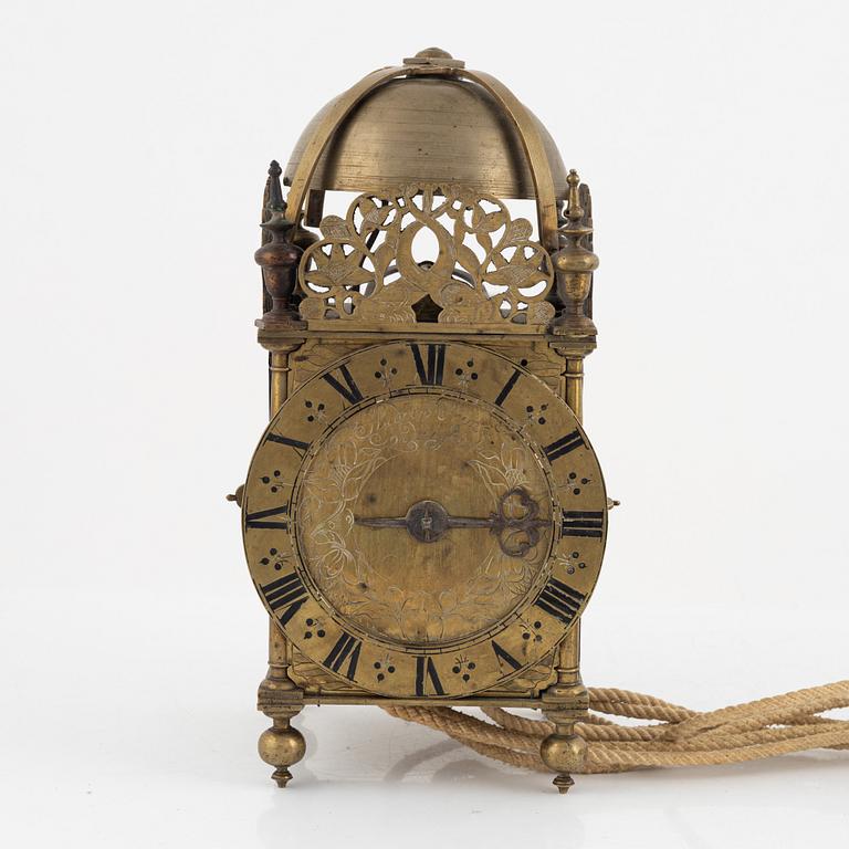 A Baroque brass lantern clock with bracket marked Andrew Prime Londini Fecit (active 1641- ca.1682).