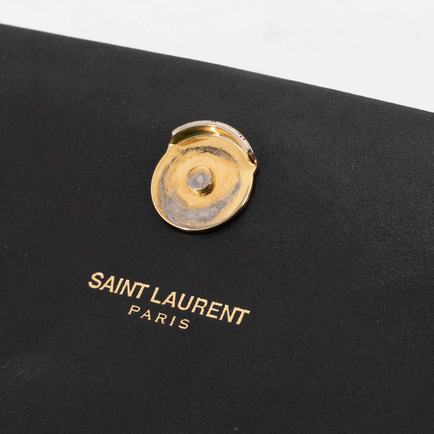 Yves Saint Laurent, a black smooth leather 'Kate' handbag.