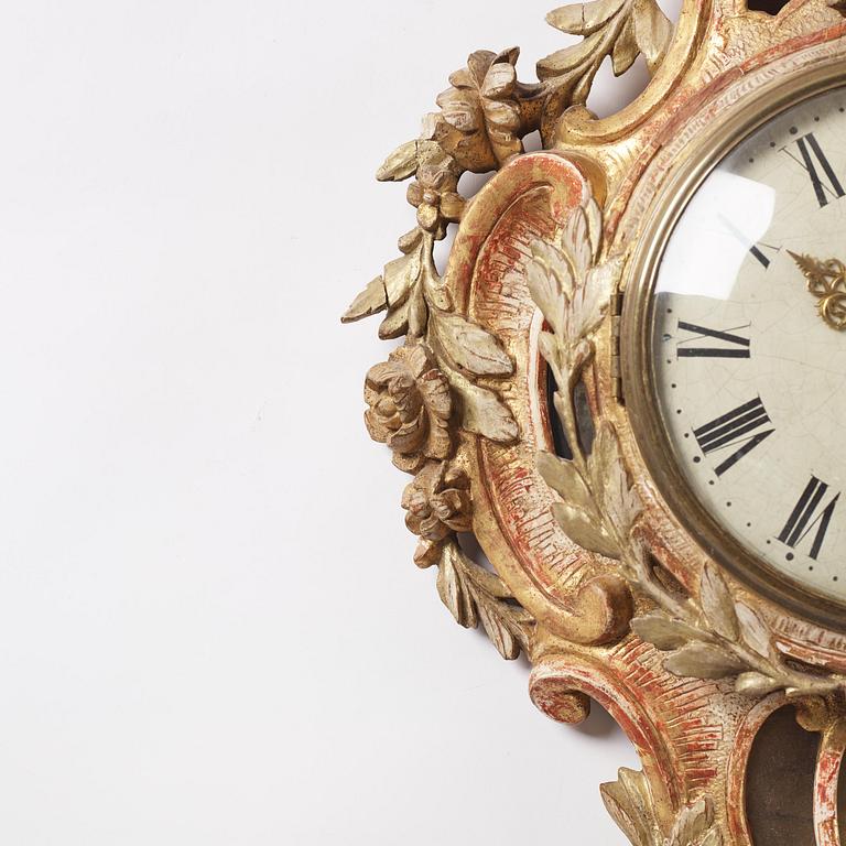 A Swedish Rococo giltwood cartel clock, Stockholm, later part of the 18th century.