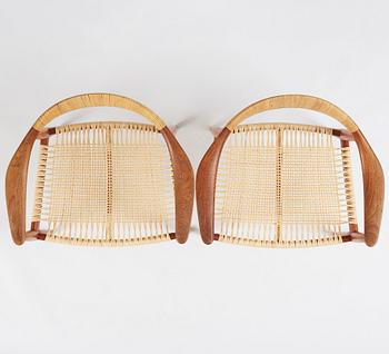 Hans J. Wegner, a pair of teak and rattan 'The Chair', JH-503, Johannes Hansen, Denmark 1950s.