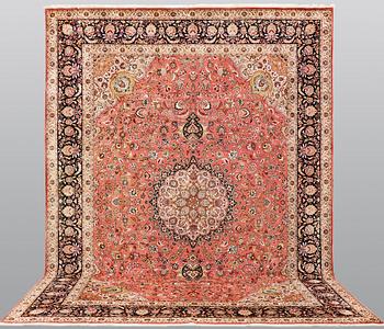 A part silk figural Tabriz carpet, so-called 50 Radj, c. 405 x 299 cm.