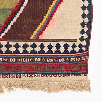 An antique Qashqai kilim rug, c. 380 x 148 cm.