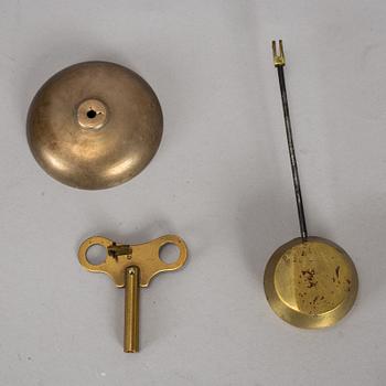 A brass mantle clock, early 20th century.