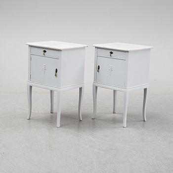 A pair of painted bedside tables with marble tops, 1920's.