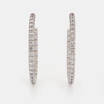 A pair of Tiffany "Metro" 18K white gold hoops set with round brilliant-cut diamonds.