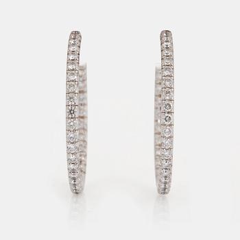 1011. A pair of Tiffany "Metro" 18K white gold hoops set with round brilliant-cut diamonds.