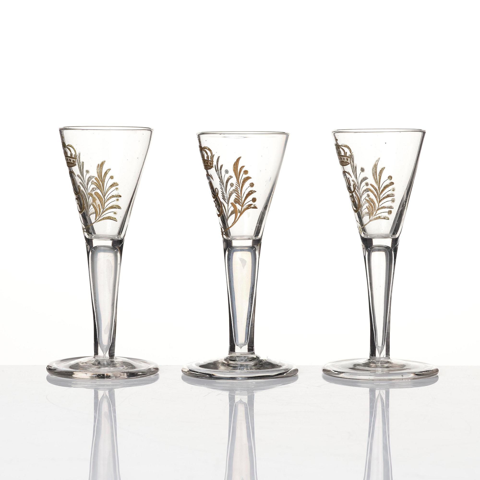 A set of six glasses and a bottle, Sweden, 18th century with King Gustavus IIIs monogram.