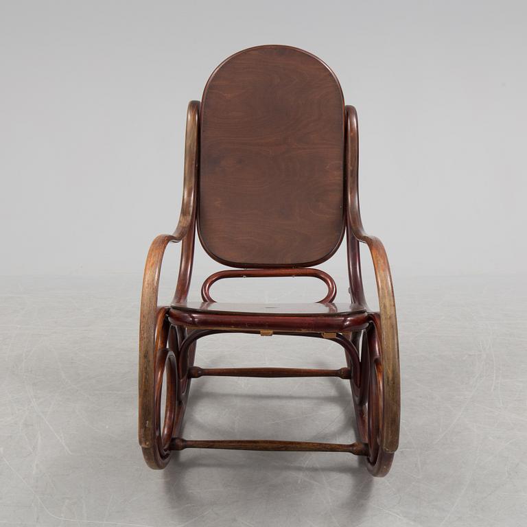 A stained rocking chair by Thonet, about 1900.