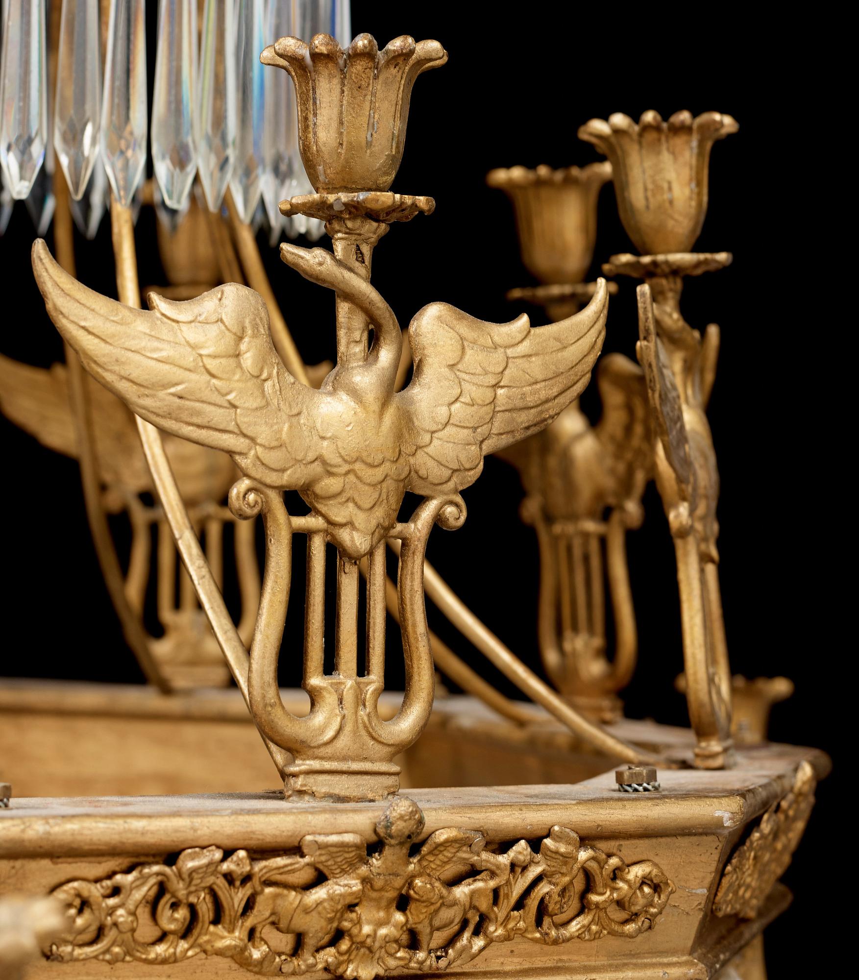 A German 19th century sixteen-light chandelier in the manner of Karl Friedrich Schinkel.