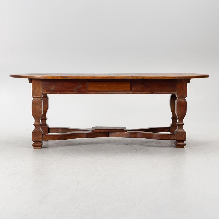 An oak dining table, Baroque early 18th century and Baroque style 19th/20th century.