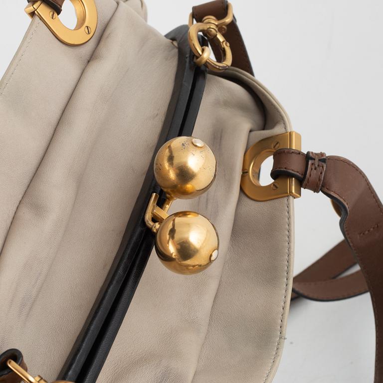 Marni, a leather handbag.