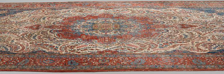 A carpet, a semi-antique Qum, ca 380,5-387,5 x 250,5-259,5 cm.