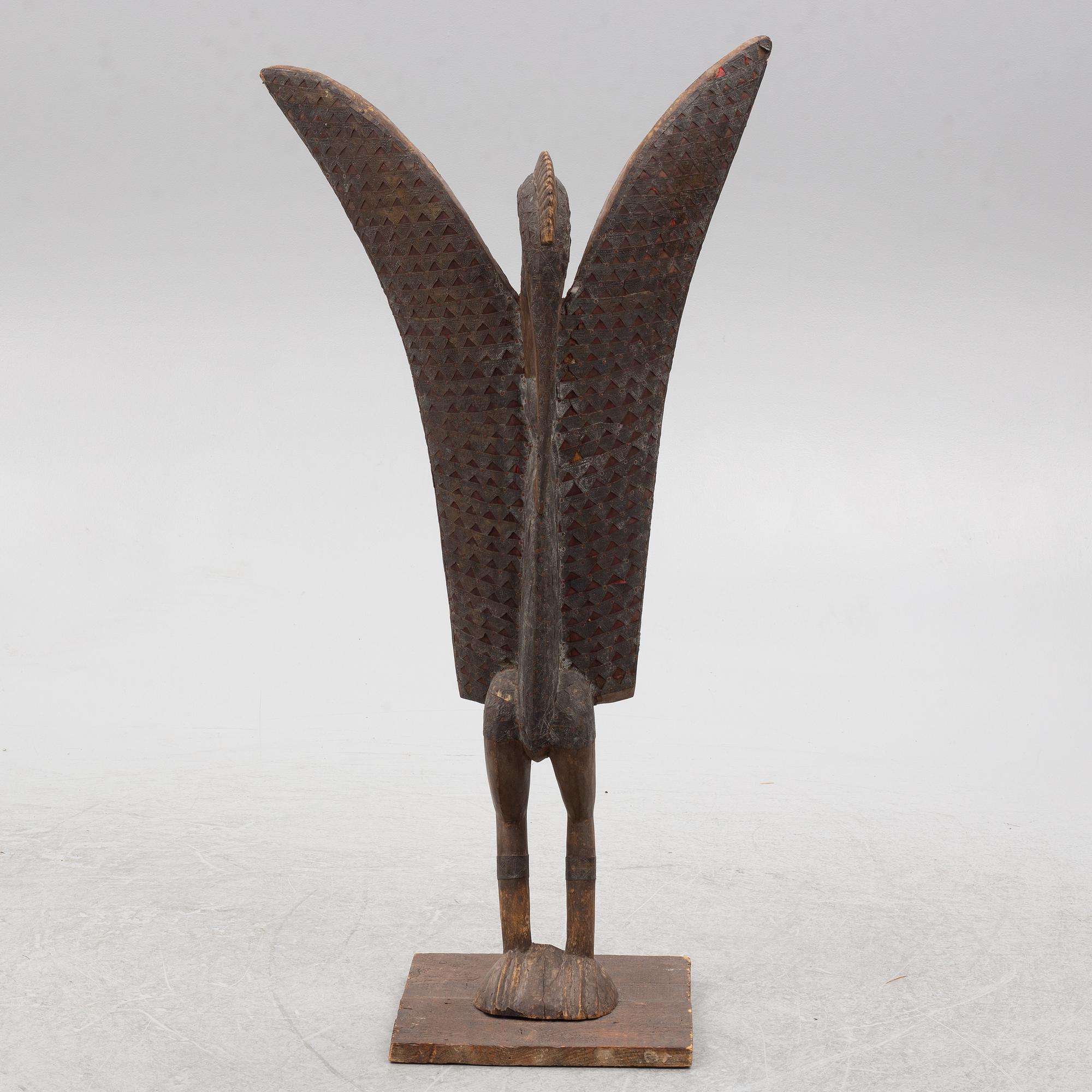 A sculpture, likely Ivory Coast, 20th century.