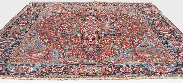 An Antique Heriz carpet, North west persia, c. 380 x 310 cm.
