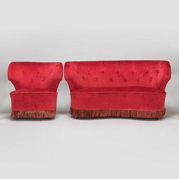 A mid-20th -century sofa and armchair.