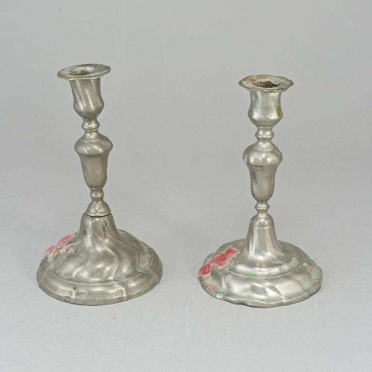 Two pewter rococo candlesticks.