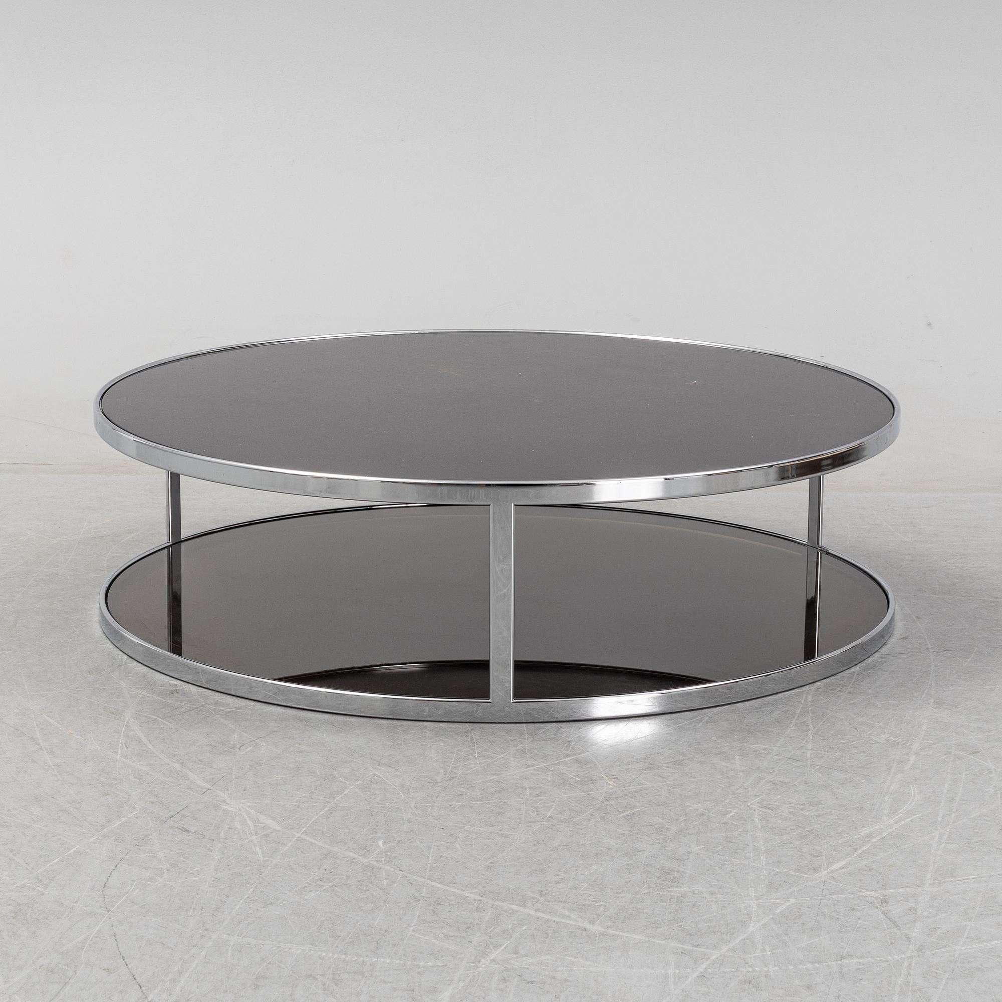 Rodolgo Dordoni, a 'Huber glass and chrome coffe table for Minotti.