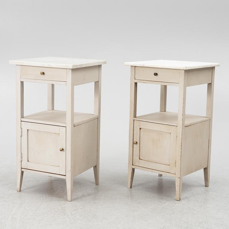 A matched pair of bedside tables.
