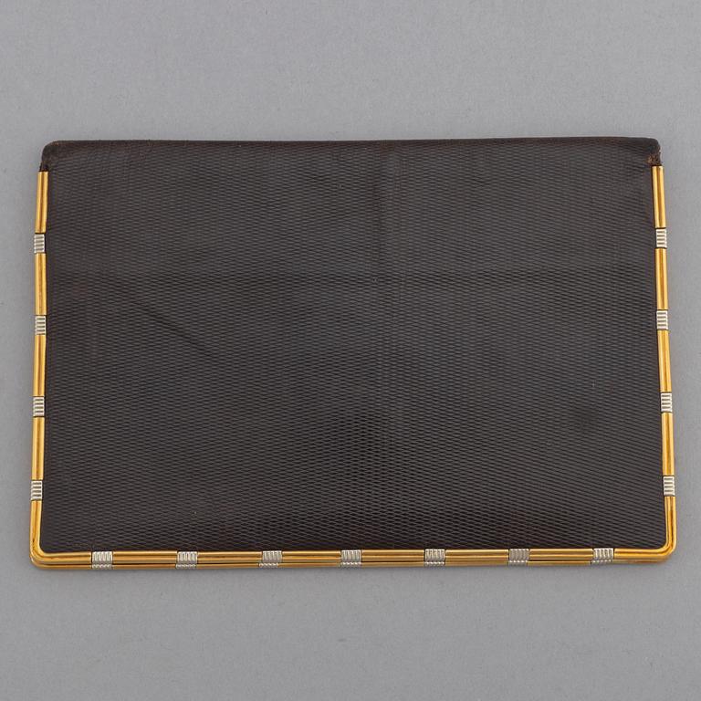 Cartier, troligen. Plånbok.