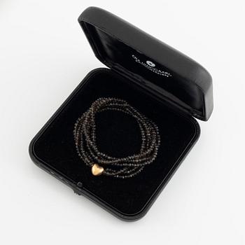 Ole Lynggaard,  smoky quartz necklace, clasp gold heart.