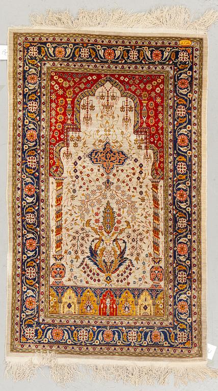 A rug, old Hereke, silke, ca 119 x 71 cm.