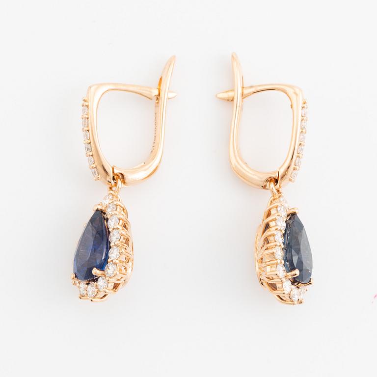 Pear shaped sapphire and brilliant cut diamond earrings.