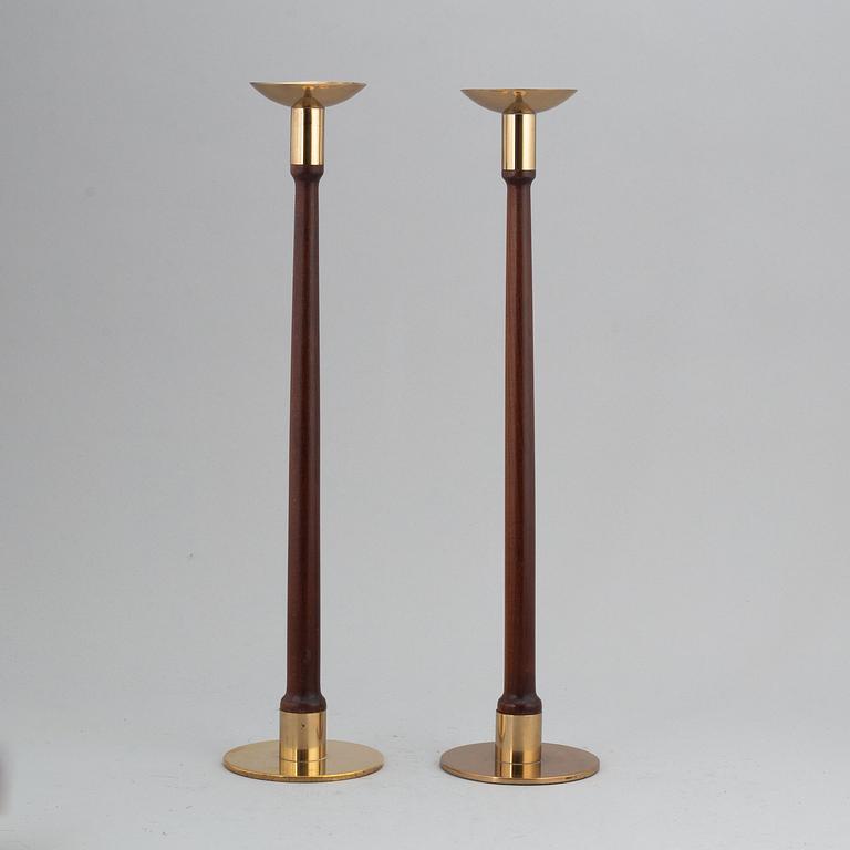 HANS-AGNE JAKOBSSON, a pair of brass and teak candle holders, Markaryd, mid 20th century.