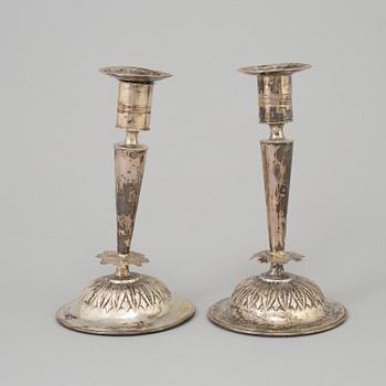 A pair of empire silver candles, presumably Stockholm, dated 1819.
