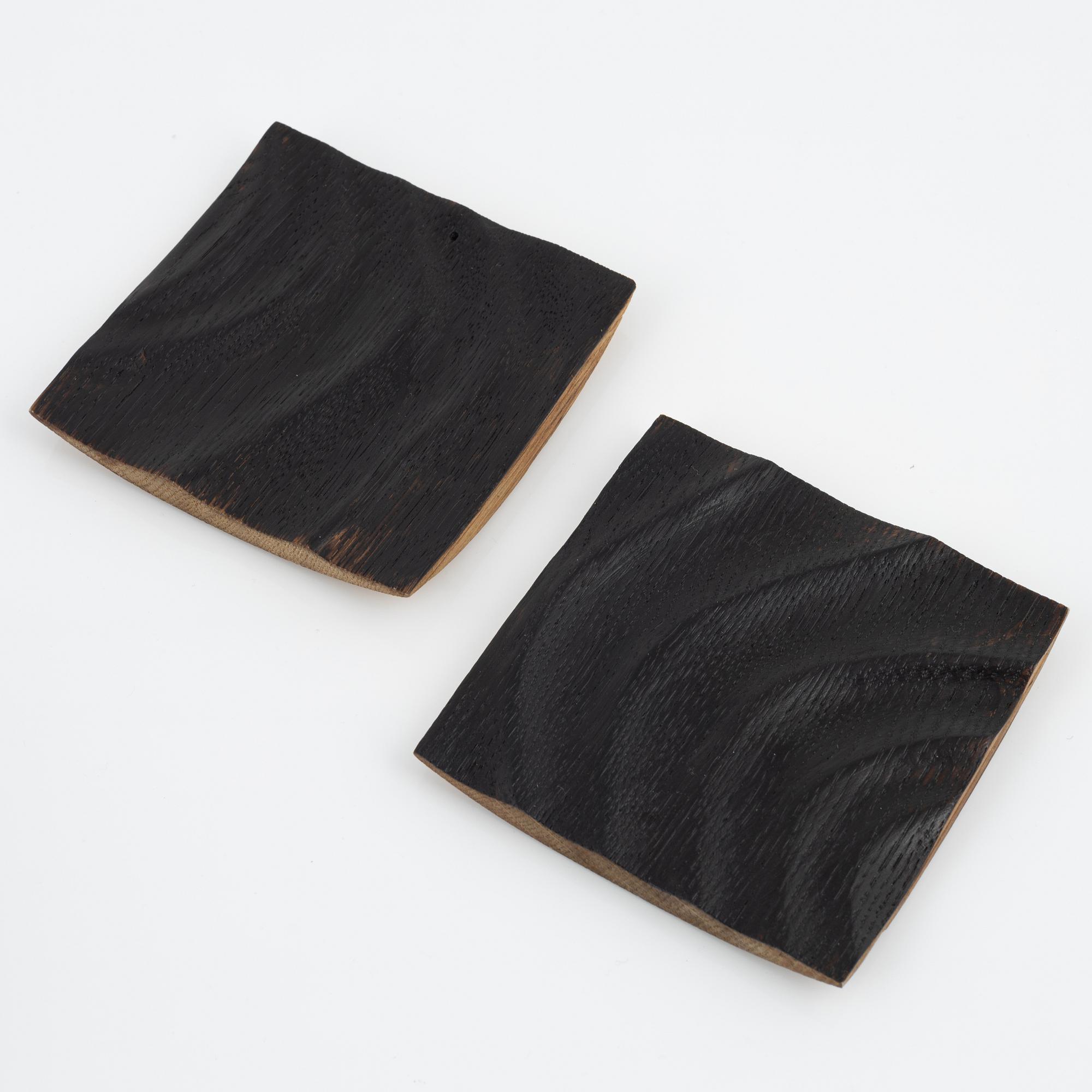 Magnus Ek, a set of eight oak plates for Oaxen Krog.